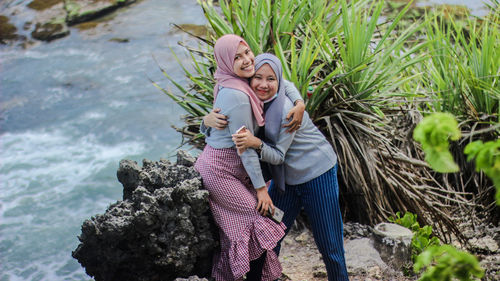 Portrait of smiling female friends wearing hijab