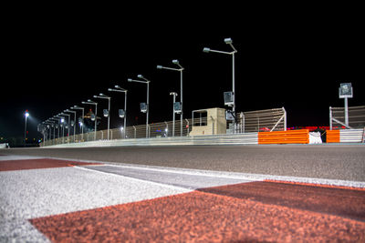 View of street against clear sky at night