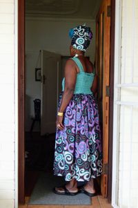 Woman standing at entrance of building