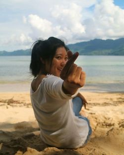 Portrait of a smiling young woman on beach