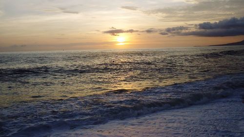 Scenic view of sea at sunset