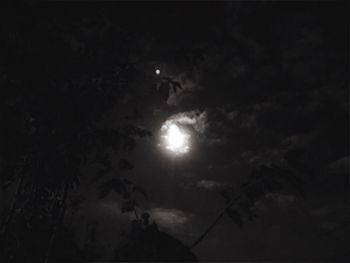 Low angle view of moon in sky at night