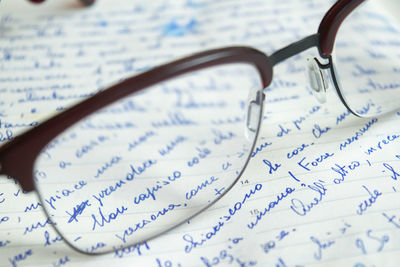 Close-up of eyeglasses on paper