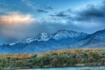 Scenic view of snowcapped mountains against sky