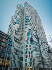 Low angle view of modern buildings against sky