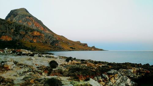 Scenic view of beach against clear sky