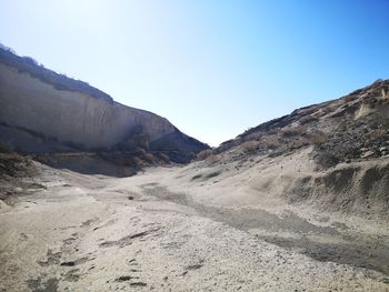 Scenic view of mountains against clear blue sky