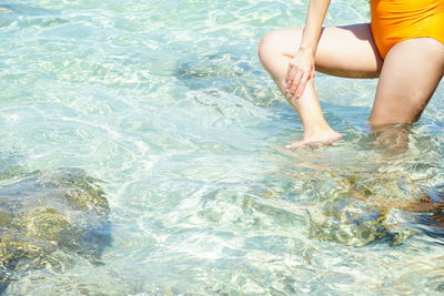 Low section of man in swimming pool