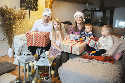 Happy family with three children celebration christmas at  home