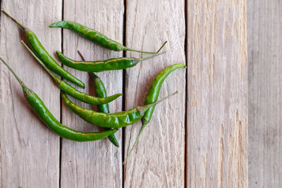 Close-up of green chili peppers on table