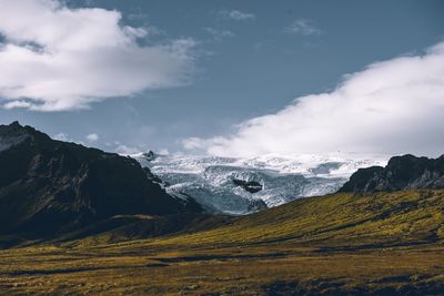Scenic view of snowcapped mountains against sky