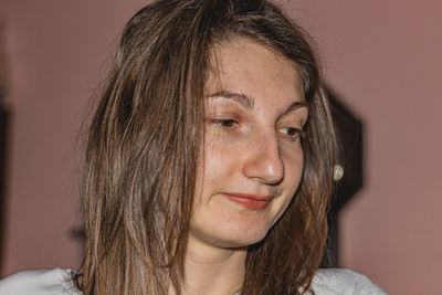 Close-up portrait of a young woman looking away