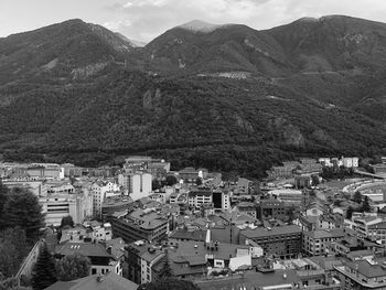 High angle view of townscape and mountains