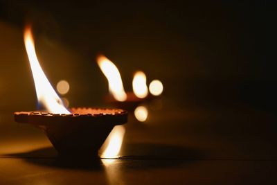 Close-up of illuminated diya