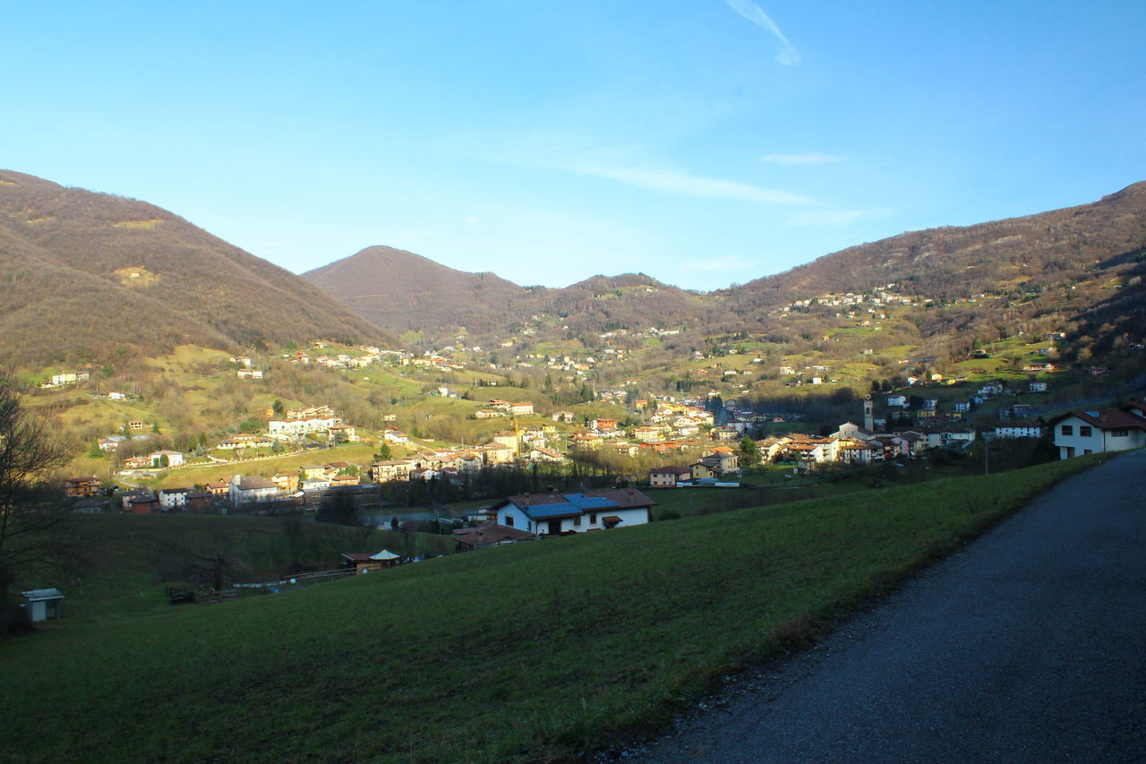 TOWN BY MOUNTAIN AGAINST SKY