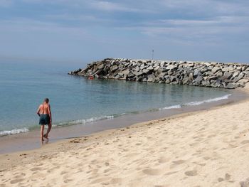 Woman standing on beach