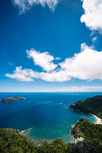 High angle view of sea against blue sky