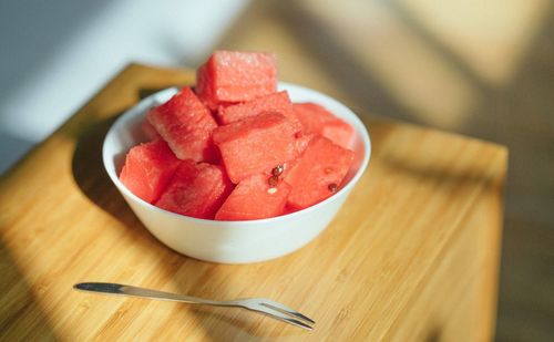 High angle view of strawberries in bowl on table