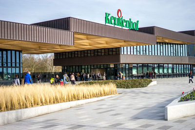 Group of people walking in front of building