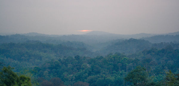 Scenic view of mountains against sky during rainy season