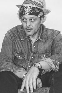 Portrait of man sitting outdoors