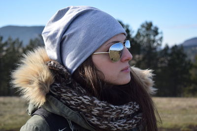 Close-up of young woman wearing sunglasses