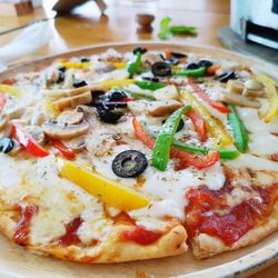 Close-up of pizza served on table