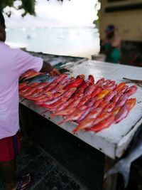 Man selling fishes at market