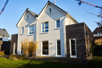 Residential buildings against blue sky