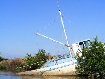 Traditional windmill against clear blue sky