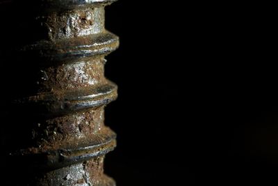 Stack of metal against black background