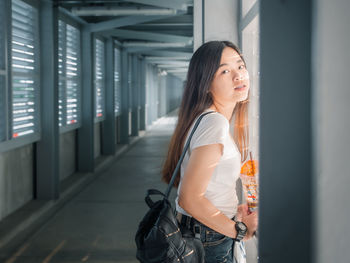 Young woman standing in city