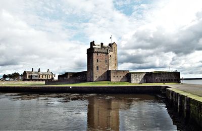 Historic building against cloudy sky