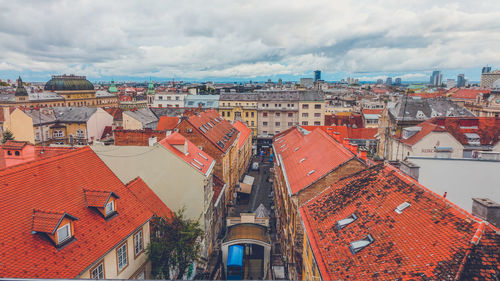 High angle view of buildings in city against sky