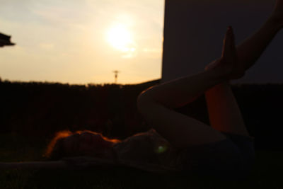 Close-up of silhouette man against sky during sunset