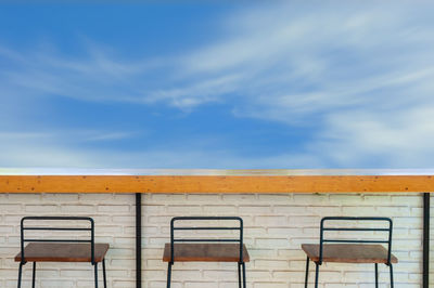 Empty seats against blue sky