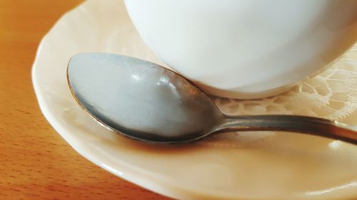 High angle view of coffee in plate on table