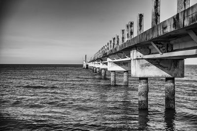 Pier over sea against sky