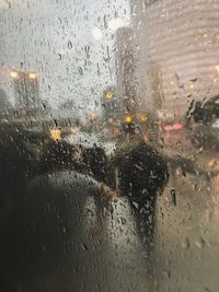 Full frame shot of wet glass window in rainy season