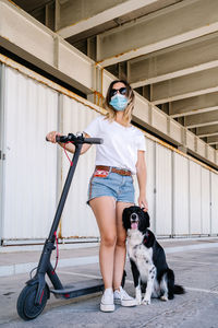 Full length of woman with dog