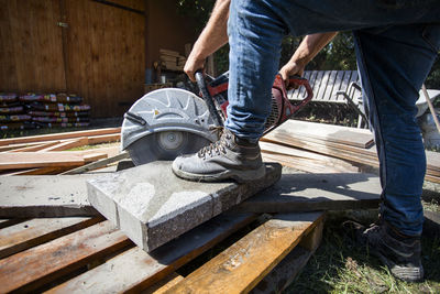 Low section of man working at construction site