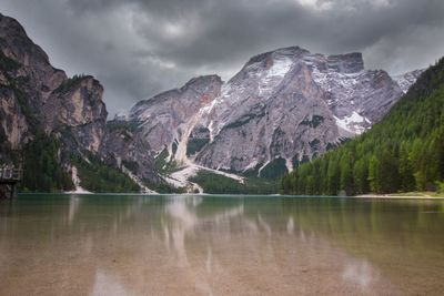 Scenic view of lake against cloudy sky