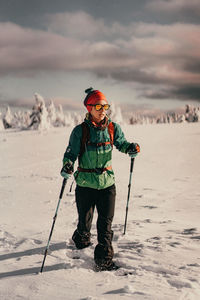 Full length of girl standing on snow