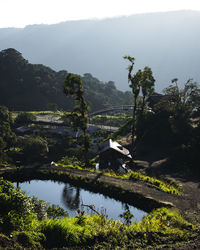 Scenic view of lake and mountains against sky