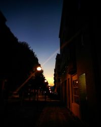 Walkway in city at dusk