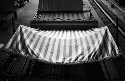 Low angle view of clothes hanging on bed