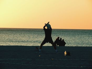 Silhouette of woman on beach