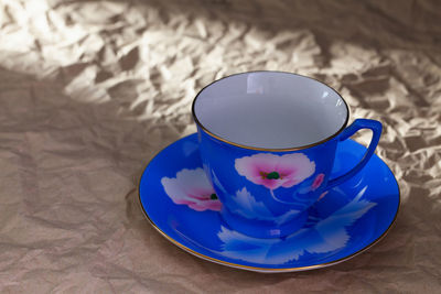 High angle view of coffee cup on table