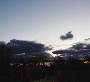 Scenic view of landscape against sky at dusk