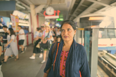 Portrait of woman standing at home